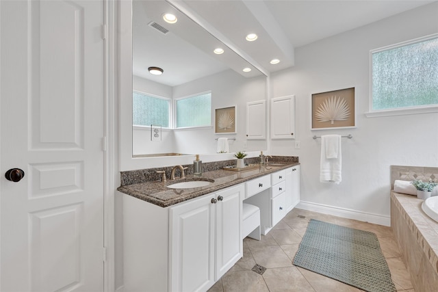 135 Wisteria Walk Cir, The Woodlands, TX 77381 - bathroom with double vanity, a garden tub, recessed lighting, and tile patterned floors