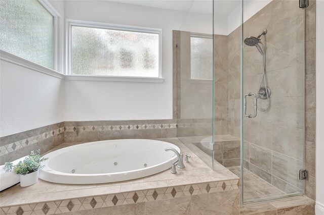 135 Wisteria Walk Cir, The Woodlands, TX 77381 - bathroom with a jetted tub and a stall shower
