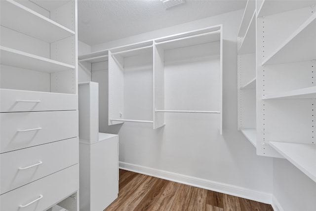 135 Wisteria Walk Cir, The Woodlands, TX 77381 - walk in closet with wood finished floors
