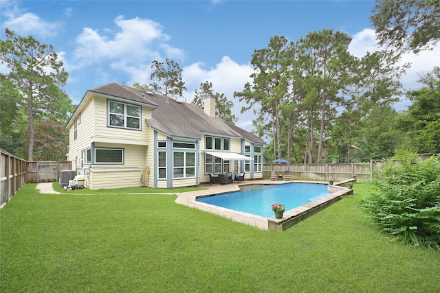 135 Wisteria Walk Cir, The Woodlands, TX 77381 - rear view of house featuring a chimney and a fenced backyard