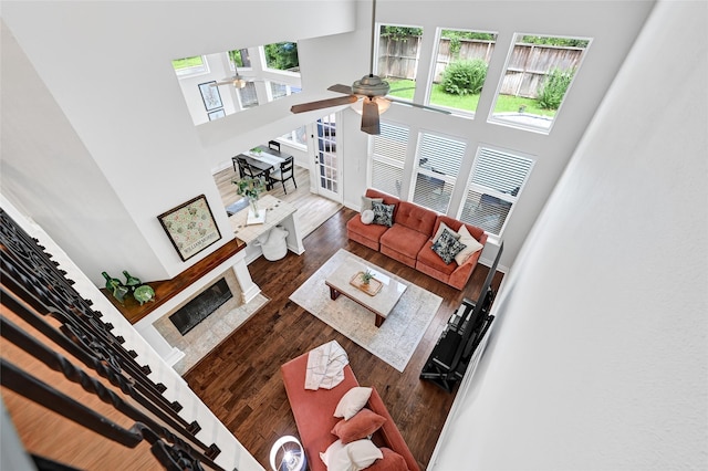 135 Wisteria Walk Cir, The Woodlands, TX 77381 - living area with a ceiling fan, a high ceiling, and wood finished floors
