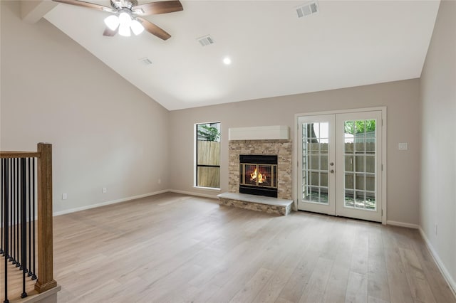 3802 Knollcrest Dr, Montgomery, TX 77356 - unfurnished living room with healthy amount of natural light, ceiling fan, light wood finished floors, high vaulted ceiling, and french doors