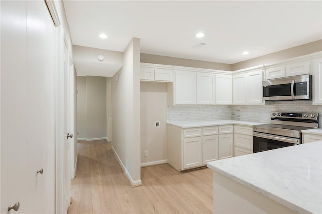 3802 Knollcrest Dr, Montgomery, TX 77356 - kitchen with stainless steel appliances, light wood-style floors, decorative backsplash, light stone counters, and recessed lighting