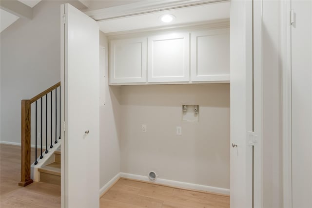 3802 Knollcrest Dr, Montgomery, TX 77356 - washroom with cabinet space, light wood finished floors, and washer hookup