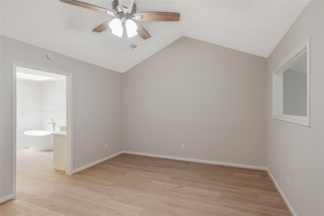 3802 Knollcrest Dr, Montgomery, TX 77356 - unfurnished bedroom featuring light wood-type flooring, vaulted ceiling, a ceiling fan, and ensuite bath