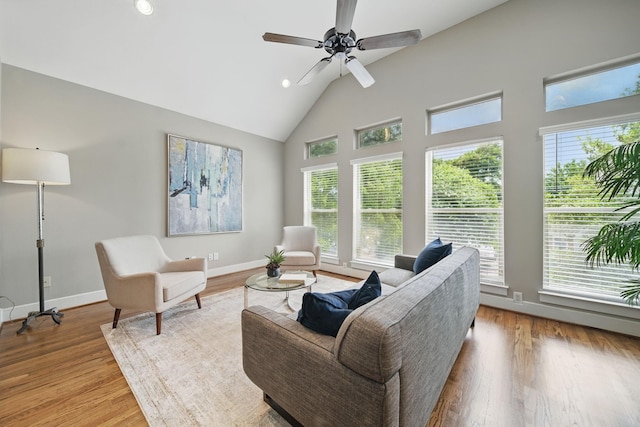 1028 Dunbar St, Houston, TX 77009 - living room featuring healthy amount of natural light, high vaulted ceiling, wood finished floors, a ceiling fan, and recessed lighting