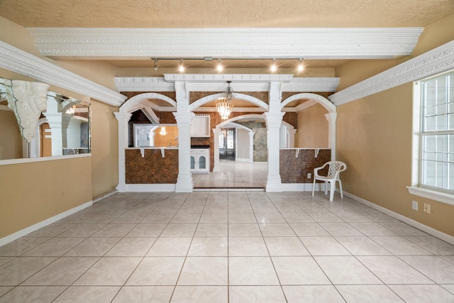 7847 Broadview Dr, Houston, TX 77061 - interior space featuring decorative columns, arched walkways, track lighting, and beamed ceiling