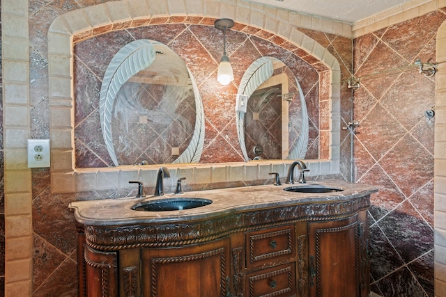 7847 Broadview Dr, Houston, TX 77061 - full bathroom with tile walls, double vanity, and backsplash
