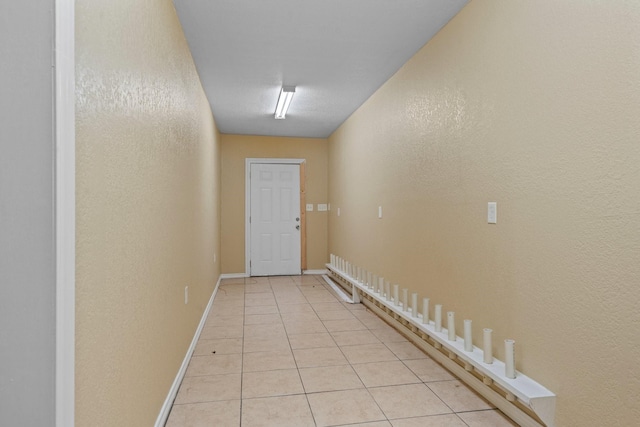 7847 Broadview Dr, Houston, TX 77061 - hall featuring a textured wall and light tile patterned floors