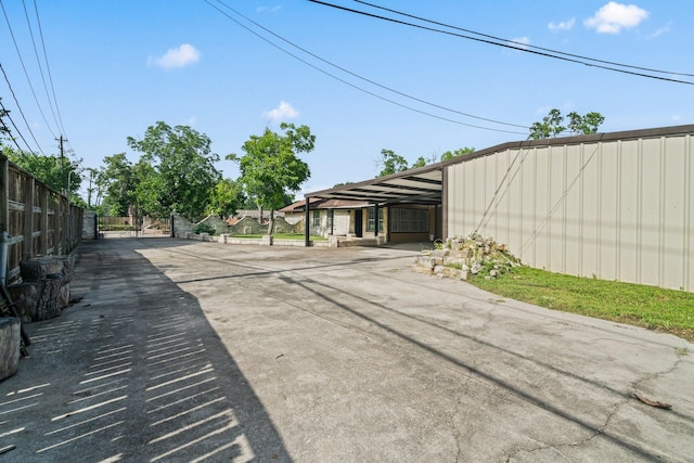 7847 Broadview Dr, Houston, TX 77061 - view of concrete driveway with a gate