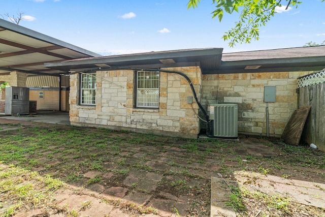 7847 Broadview Dr, Houston, TX 77061 - view of property exterior with stone siding and a cooling unit
