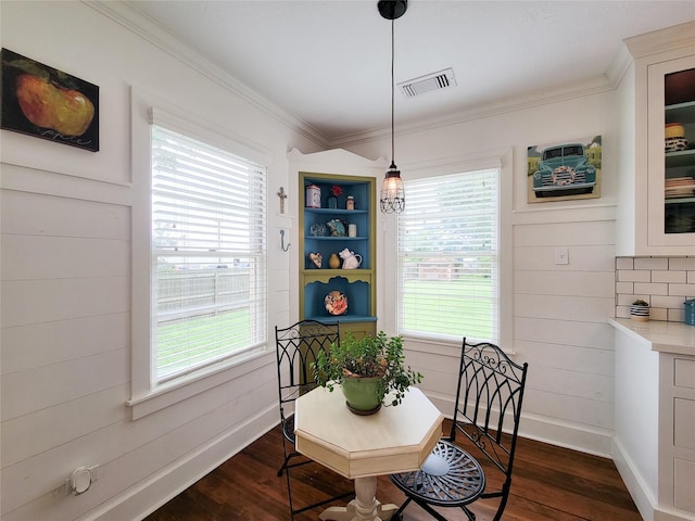 505 S Jackson St, Brenham, TX 77833 - dining room featuring dark wood-style flooring, healthy amount of natural light, and crown molding