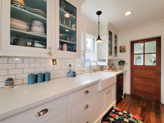 505 S Jackson St, Brenham, TX 77833 - kitchen featuring dishwasher, crown molding, backsplash, decorative light fixtures, and white cabinets