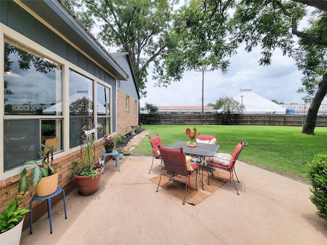 505 S Jackson St, Brenham, TX 77833 - fenced backyard featuring a patio and outdoor dining space