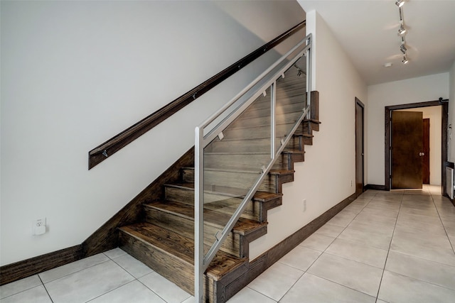 1820 Prospect St, Houston, TX 77004 - stairs featuring tile patterned floors and track lighting