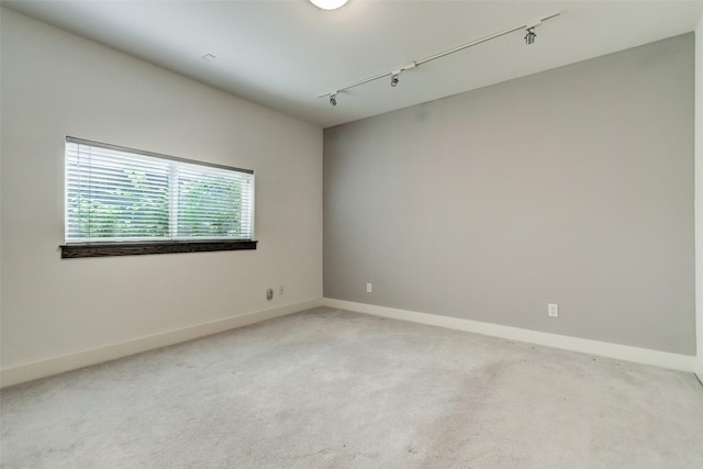 1820 Prospect St, Houston, TX 77004 - unfurnished room featuring track lighting and light carpet