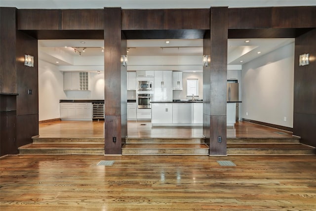 1820 Prospect St, Houston, TX 77004 - unfurnished living room featuring wood finished floors and beverage cooler