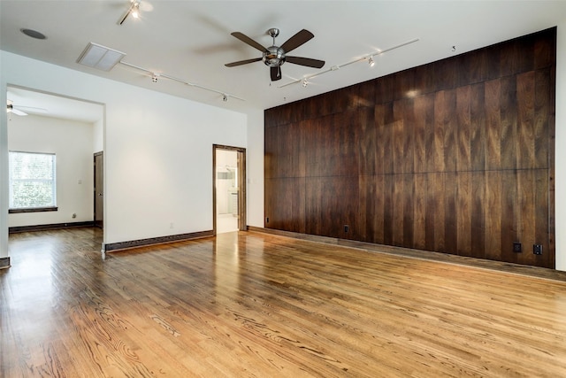 1820 Prospect St, Houston, TX 77004 - unfurnished room with rail lighting, a ceiling fan, and light wood-style flooring