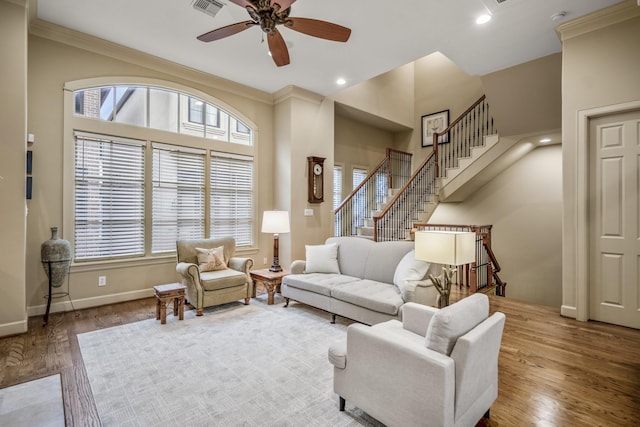5023 La Branch St, Houston, TX 77004 - living room featuring ornamental molding, stairs, wood finished floors, a ceiling fan, and recessed lighting