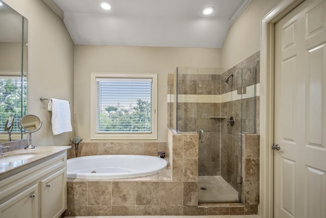 5023 La Branch St, Houston, TX 77004 - bathroom with vanity, a bath, a stall shower, and recessed lighting