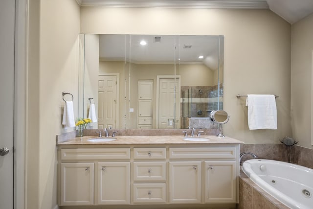 5023 La Branch St, Houston, TX 77004 - bathroom featuring a shower stall, double vanity, a tub with jets, ornamental molding, and recessed lighting