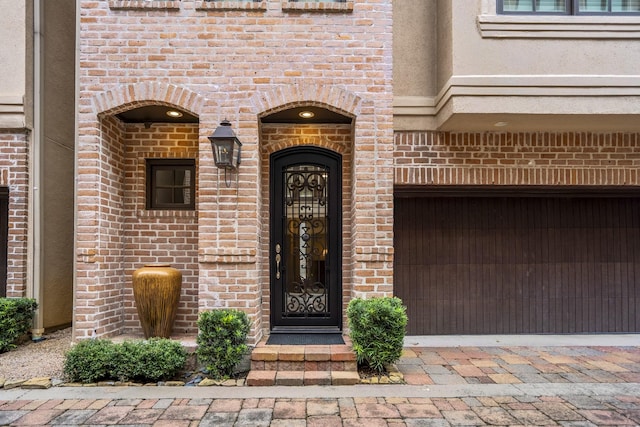 5023 La Branch St, Houston, TX 77004 - doorway to property featuring brick siding and a garage