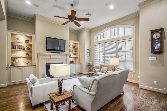 5023 La Branch St, Houston, TX 77004 - living area featuring a ceiling fan, crown molding, a tile fireplace, wood finished floors, and recessed lighting