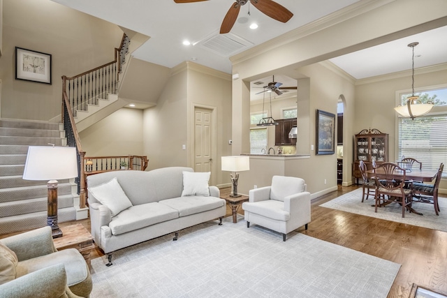 5023 La Branch St, Houston, TX 77004 - living room with a ceiling fan, ornamental molding, wood finished floors, stairway, and recessed lighting
