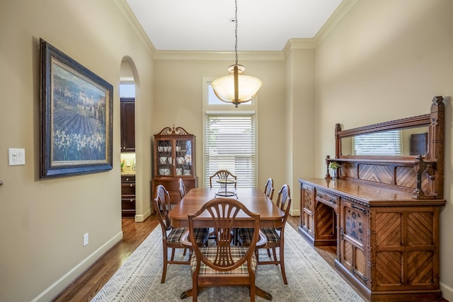 5023 La Branch St, Houston, TX 77004 - dining space featuring ornamental molding, wood finished floors, and arched walkways