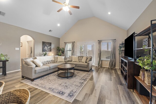 6619 Crystal Forest Trl, Katy, TX 77493 - living room with arched walkways, a ceiling fan, high vaulted ceiling, wood finished floors, and recessed lighting