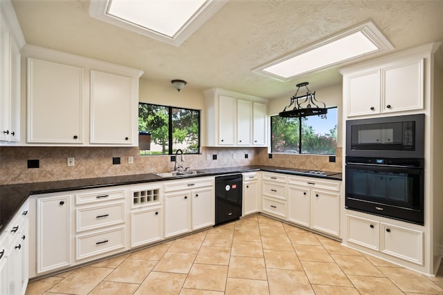 101 Fairway View Ln, Montgomery, TX 77356 - kitchen featuring black appliances, plenty of natural light, tasteful backsplash, and dark countertops