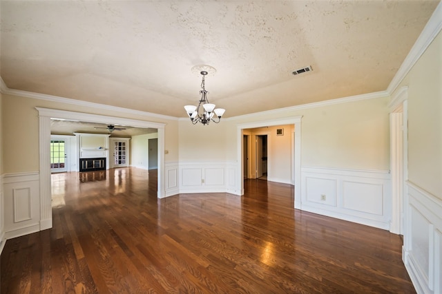 101 Fairway View Ln, Montgomery, TX 77356 - spare room with a chandelier, wood finished floors, ceiling fan, wainscoting, and a decorative wall
