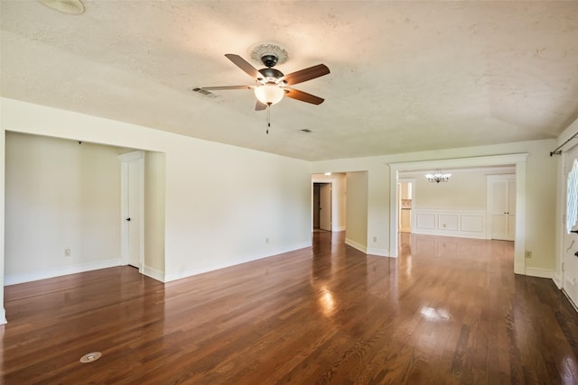 101 Fairway View Ln, Montgomery, TX 77356 - spare room with a chandelier, a ceiling fan, wood finished floors, and a textured ceiling