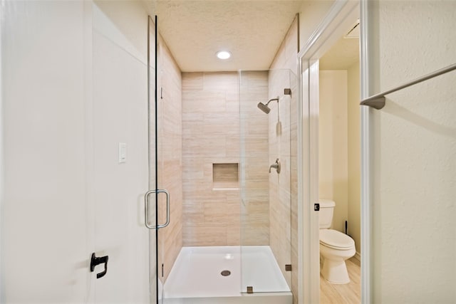 101 Fairway View Ln, Montgomery, TX 77356 - bathroom with a stall shower, a textured ceiling, and recessed lighting