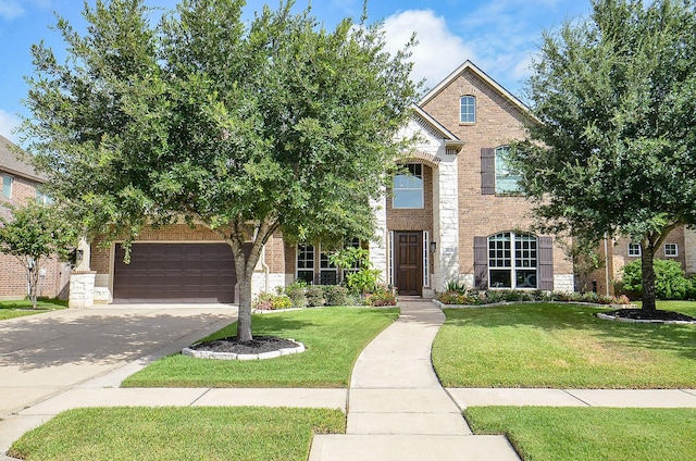 25718 Creek Ledge Dr, Katy, TX 77494 - view of front of home featuring brick siding, a front yard, concrete driveway, and an attached garage