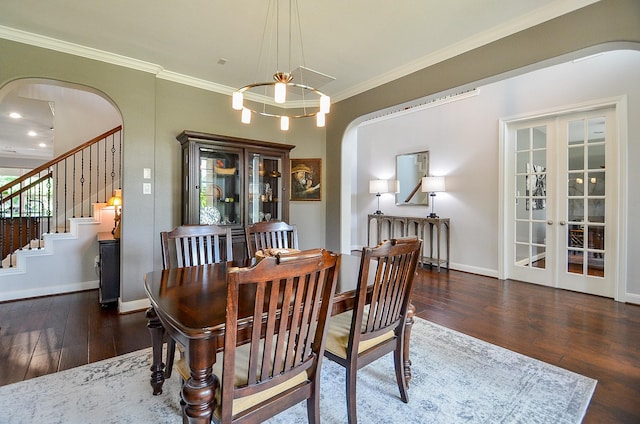 25718 Creek Ledge Dr, Katy, TX 77494 - dining space with arched walkways, wood finished floors, crown molding, stairway, and french doors