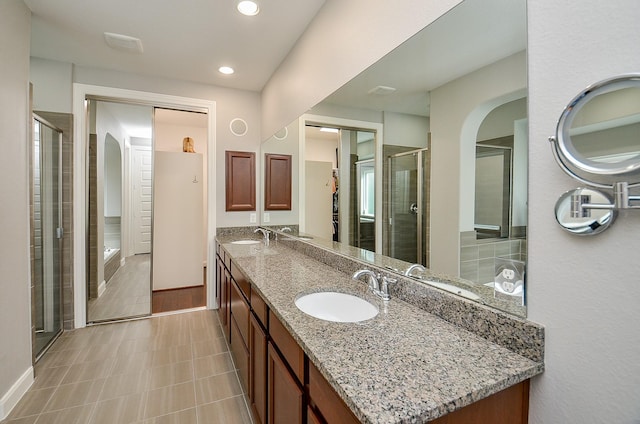 25718 Creek Ledge Dr, Katy, TX 77494 - bathroom featuring double vanity, a stall shower, and recessed lighting