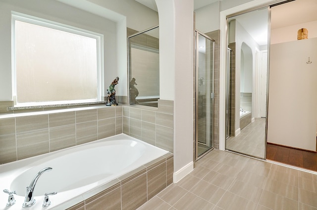 25718 Creek Ledge Dr, Katy, TX 77494 - full bathroom with a garden tub, a shower stall, and tile patterned floors