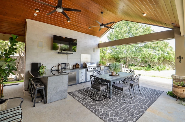 25718 Creek Ledge Dr, Katy, TX 77494 - view of patio / terrace with exterior kitchen, ceiling fan, and outdoor dining area