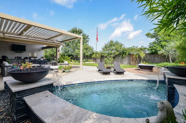 25718 Creek Ledge Dr, Katy, TX 77494 - outdoor pool with exterior kitchen, a patio, a fenced backyard, and a fire pit