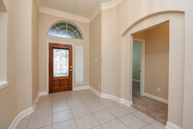 9610 Oakland Lake Way, Missouri City, TX 77459 - foyer with ornamental molding, arched walkways, light carpet, and light tile patterned floors