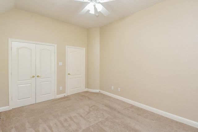 9610 Oakland Lake Way, Missouri City, TX 77459 - unfurnished bedroom with carpet, a closet, vaulted ceiling, and a ceiling fan