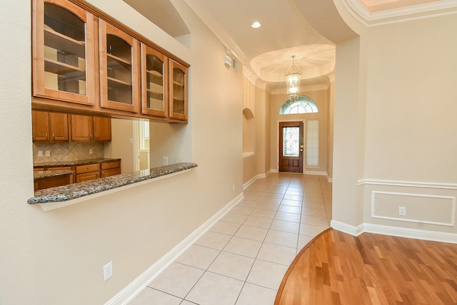 9610 Oakland Lake Way, Missouri City, TX 77459 - foyer entrance featuring crown molding, light tile patterned floors, and recessed lighting