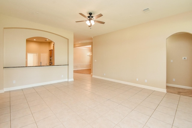 9610 Oakland Lake Way, Missouri City, TX 77459 - empty room featuring arched walkways, ceiling fan, and recessed lighting