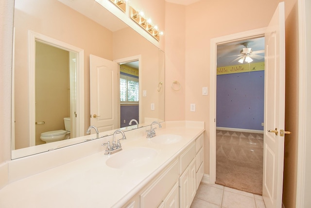 9610 Oakland Lake Way, Missouri City, TX 77459 - bathroom with double vanity, tile patterned flooring, and ceiling fan