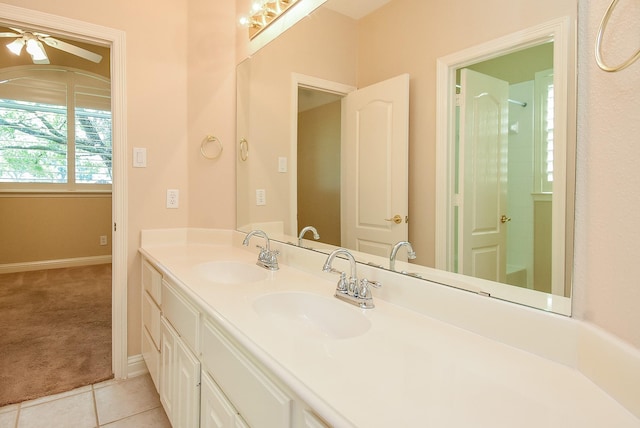 9610 Oakland Lake Way, Missouri City, TX 77459 - full bathroom featuring double vanity, ceiling fan, and tile patterned floors