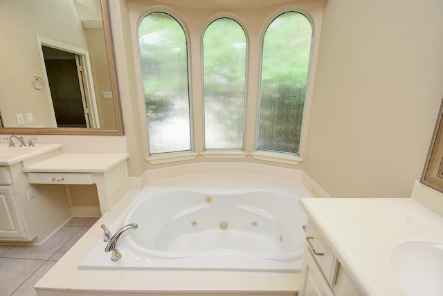 9610 Oakland Lake Way, Missouri City, TX 77459 - full bath with vanity, plenty of natural light, tile patterned floors, and a jetted tub