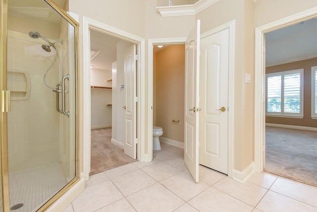 9610 Oakland Lake Way, Missouri City, TX 77459 - full bathroom featuring a shower stall, tile patterned floors, ornamental molding, and a spacious closet