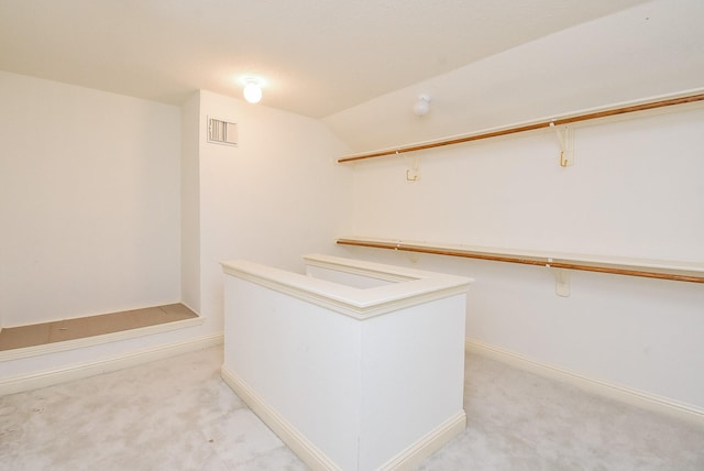 9610 Oakland Lake Way, Missouri City, TX 77459 - spacious closet featuring light colored carpet and vaulted ceiling