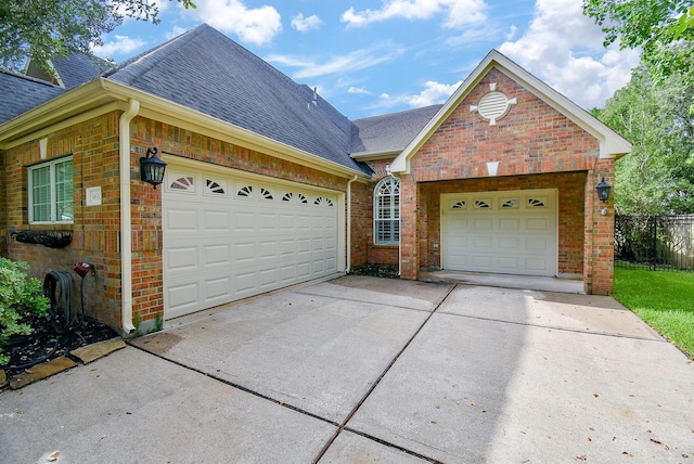 9610 Oakland Lake Way, Missouri City, TX 77459 - single story home with driveway, roof with shingles, brick siding, and an attached garage